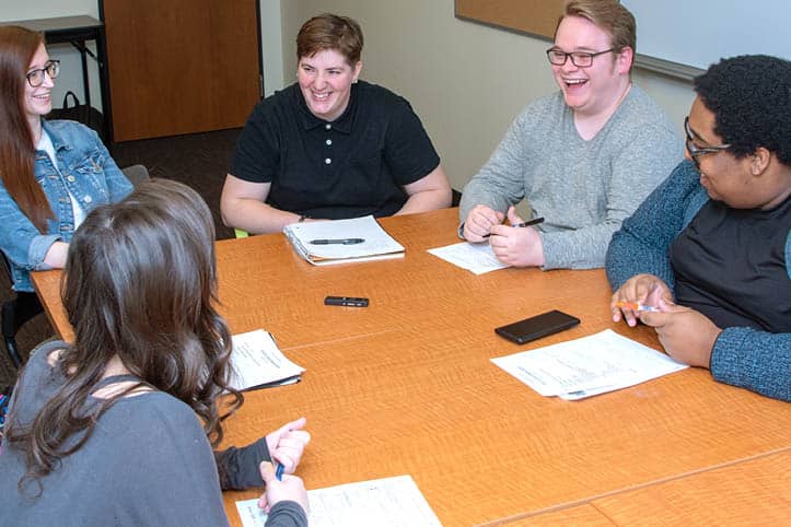 FLCC student government meeting, where a group of students at a table are making decisions together.