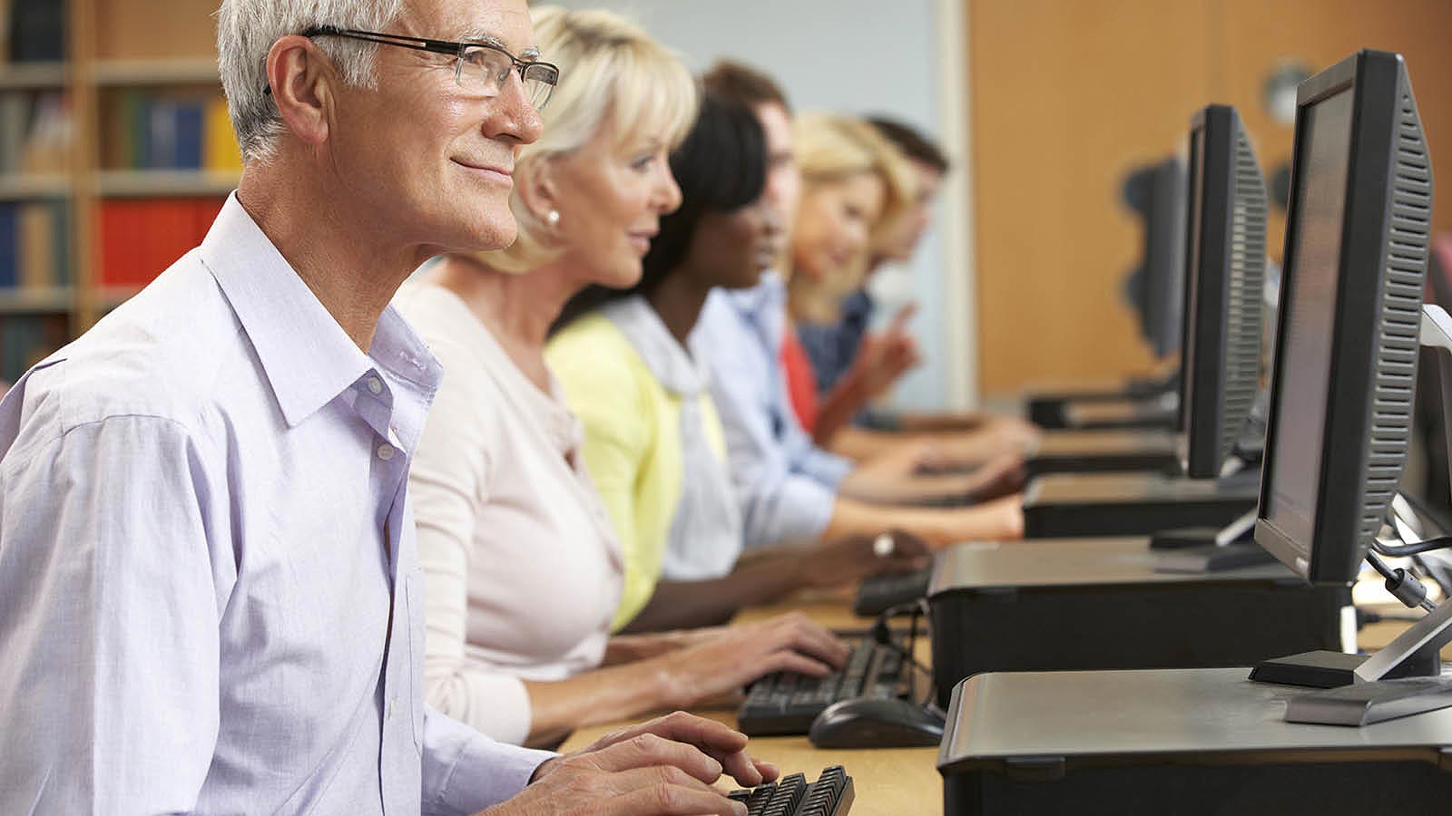 Students doing computer based research using library computers 