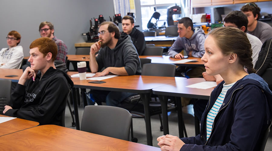 Students focusing on a classroom lecture