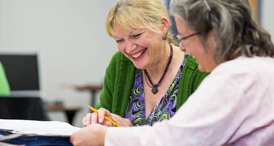 An FLCC student working with a tutor on a course assignment.